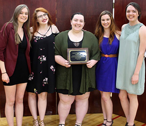 five students receiving leadership award
