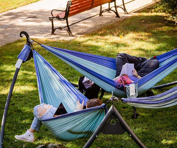 MCLA campus students in hammocks