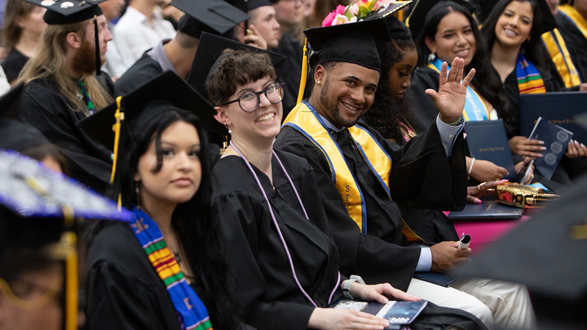 MCLA commencement with students smiling