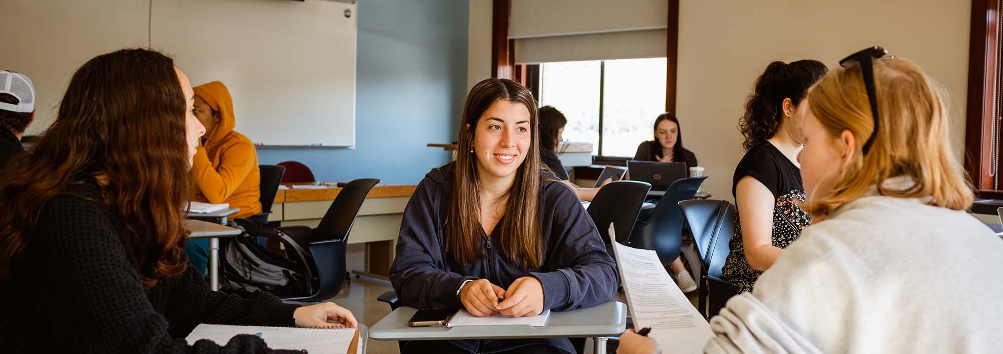 Three MCLA graduate students in discussion