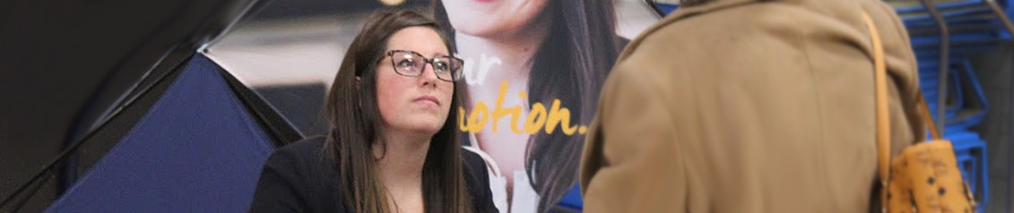 Student speaking to a hiring manager at a job fair