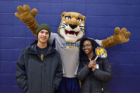Two student with MCLA mascot